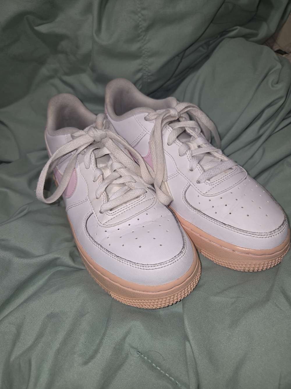 Nike White Low-Top Sneakers with Pink Swoosh and Peach Sole